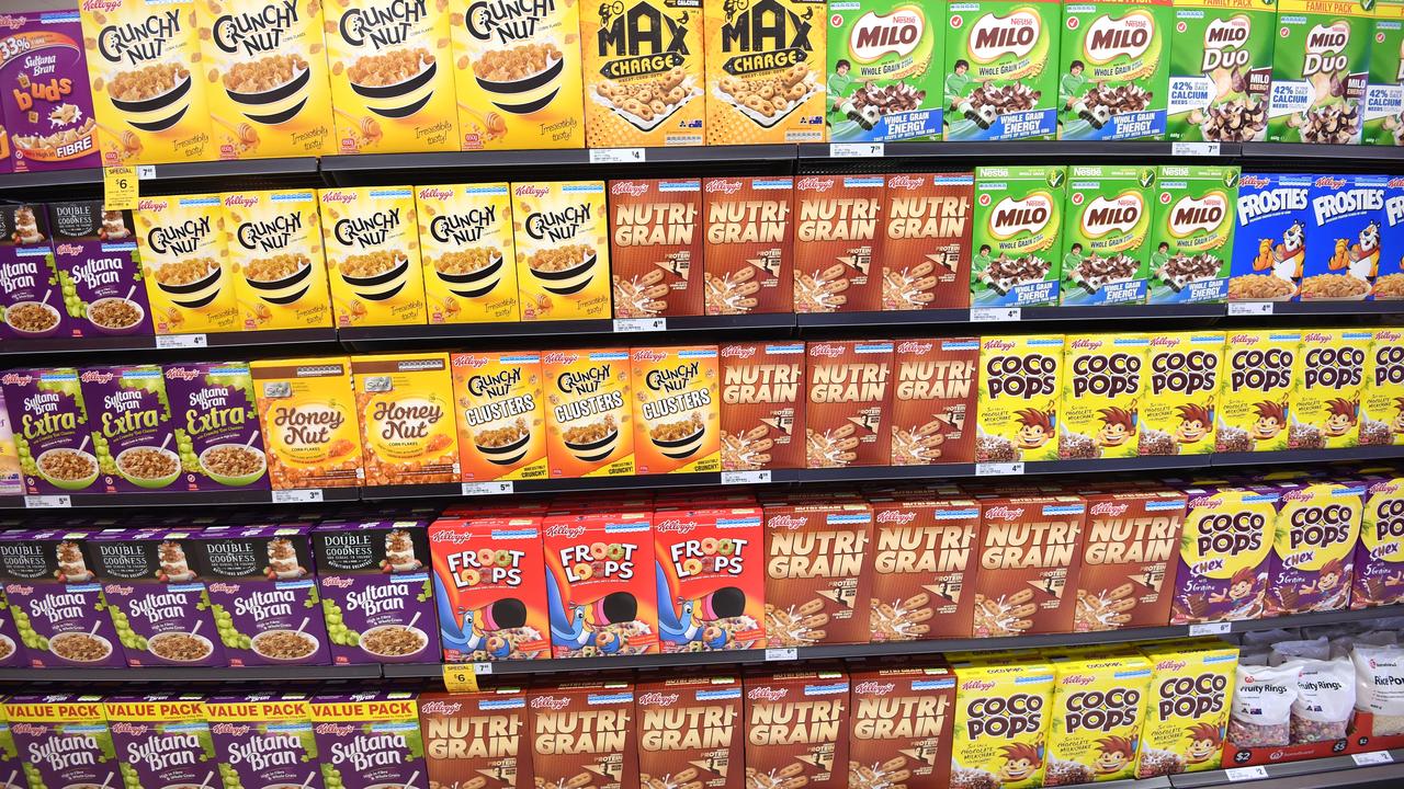 Cereal boxes in a supermarket aisle.