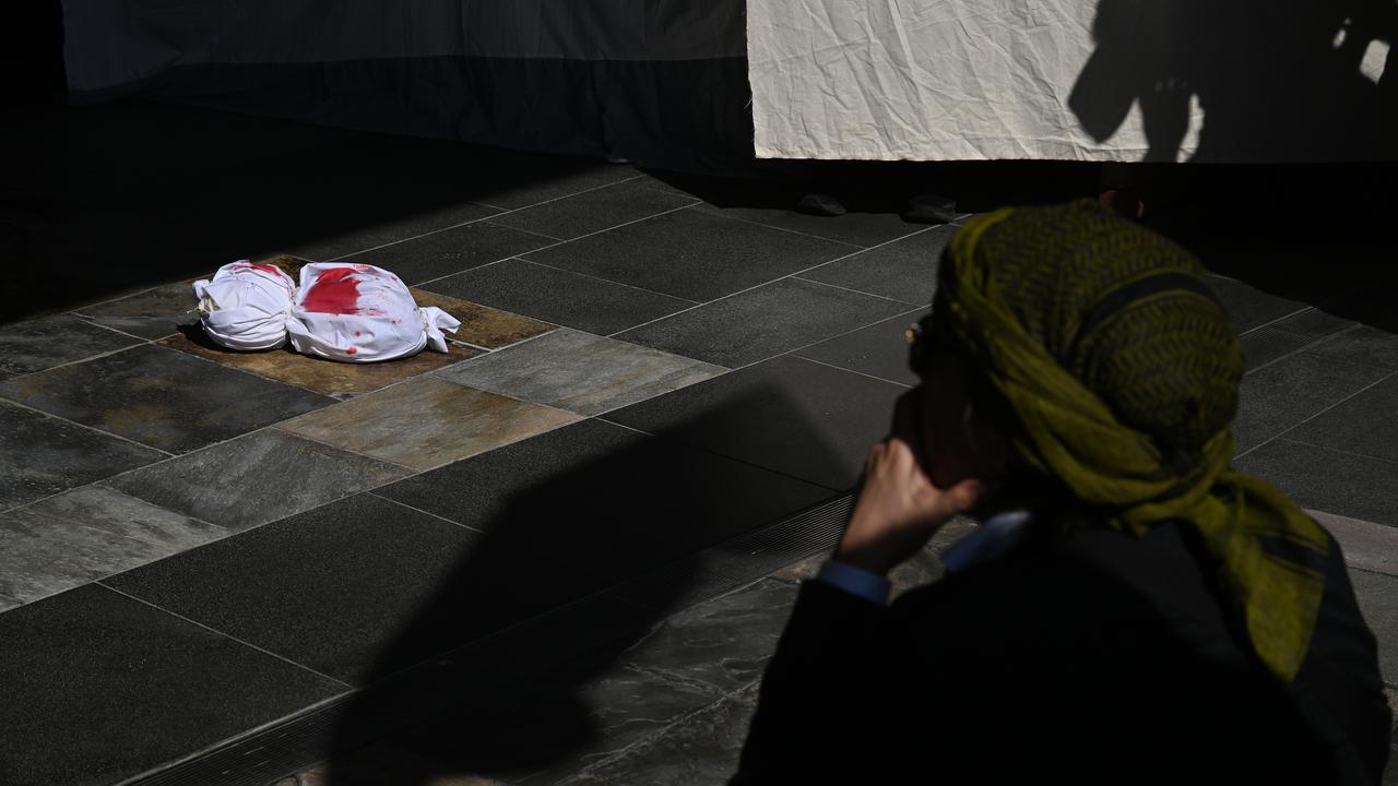 Protesters placed fake, bloodied bodies outside BP headquarters.