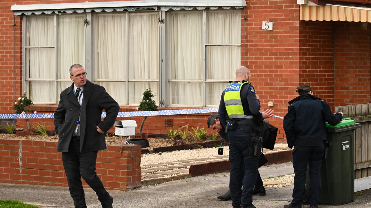 Police establish a crime scene at a residential property in Coolaroo,