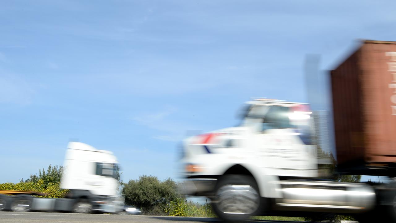 Trucks travel on a road