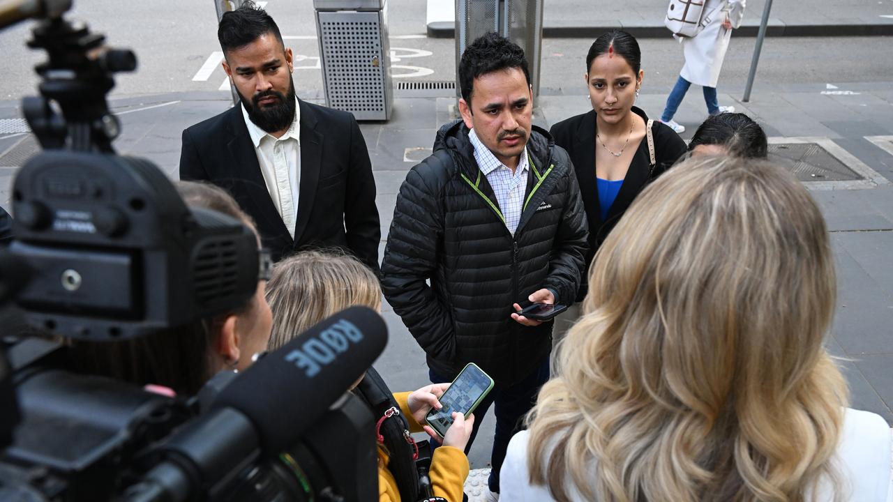 Puskal Bhusal (centre), cousin of Santos Adhikari