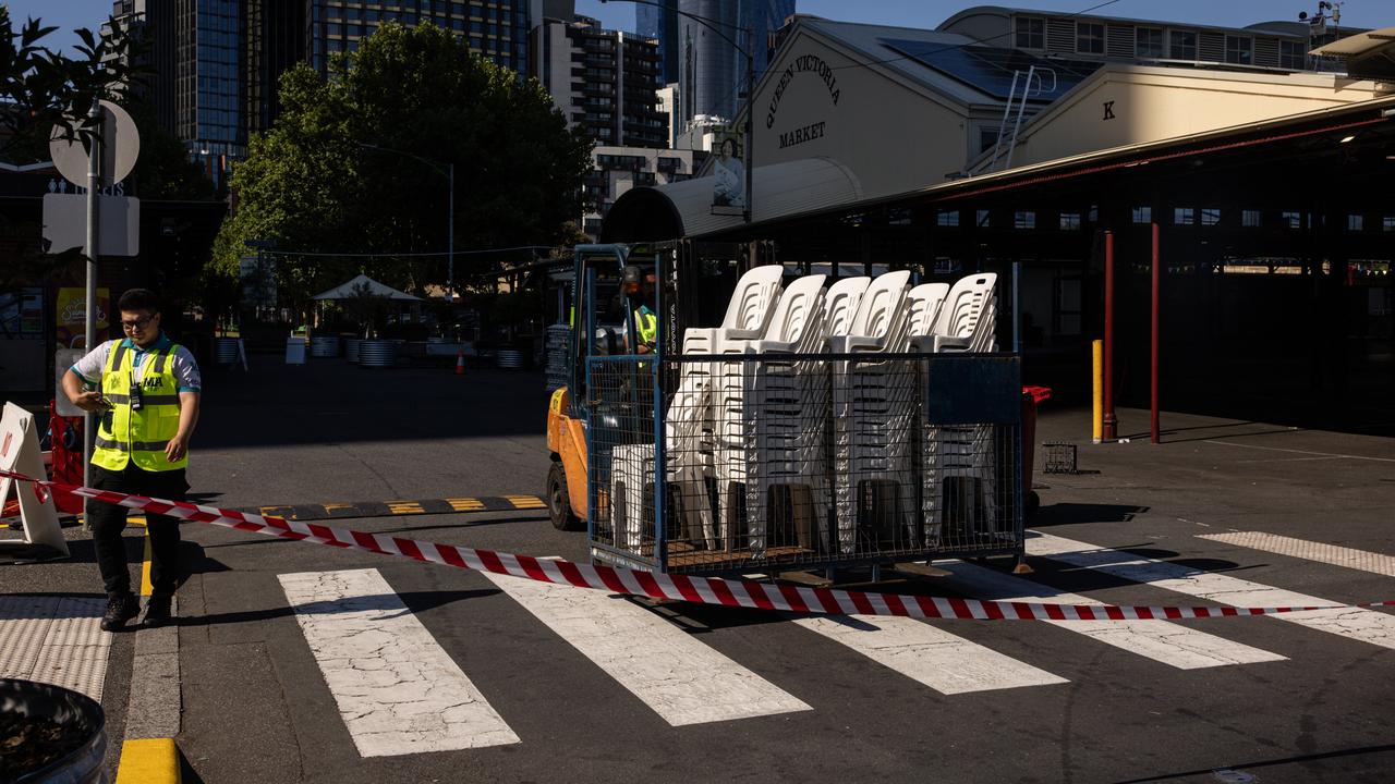 Workers are seen at the Queen Victoria Market