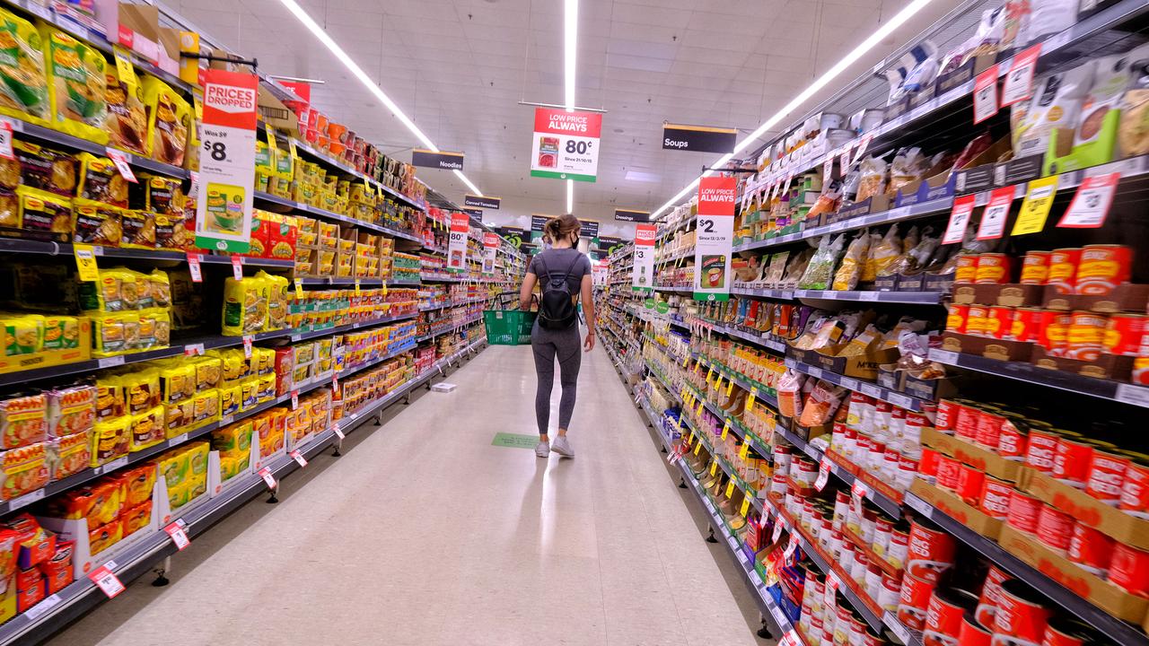 Shopper in a supermarket aisle
