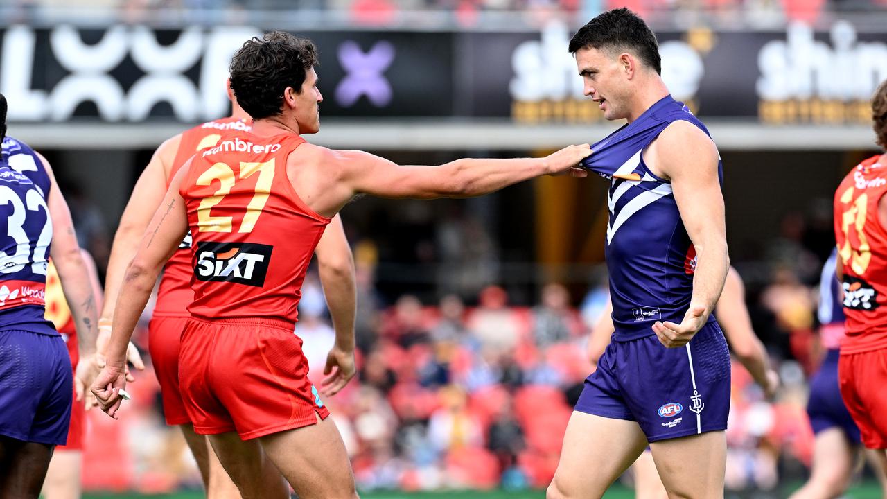 Wil Powell (left) comes to grips with Frematle's Patrick Voss.