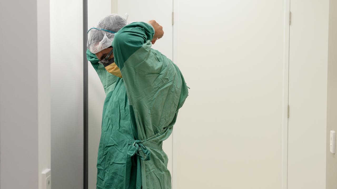 A surgeon prepares for theatre