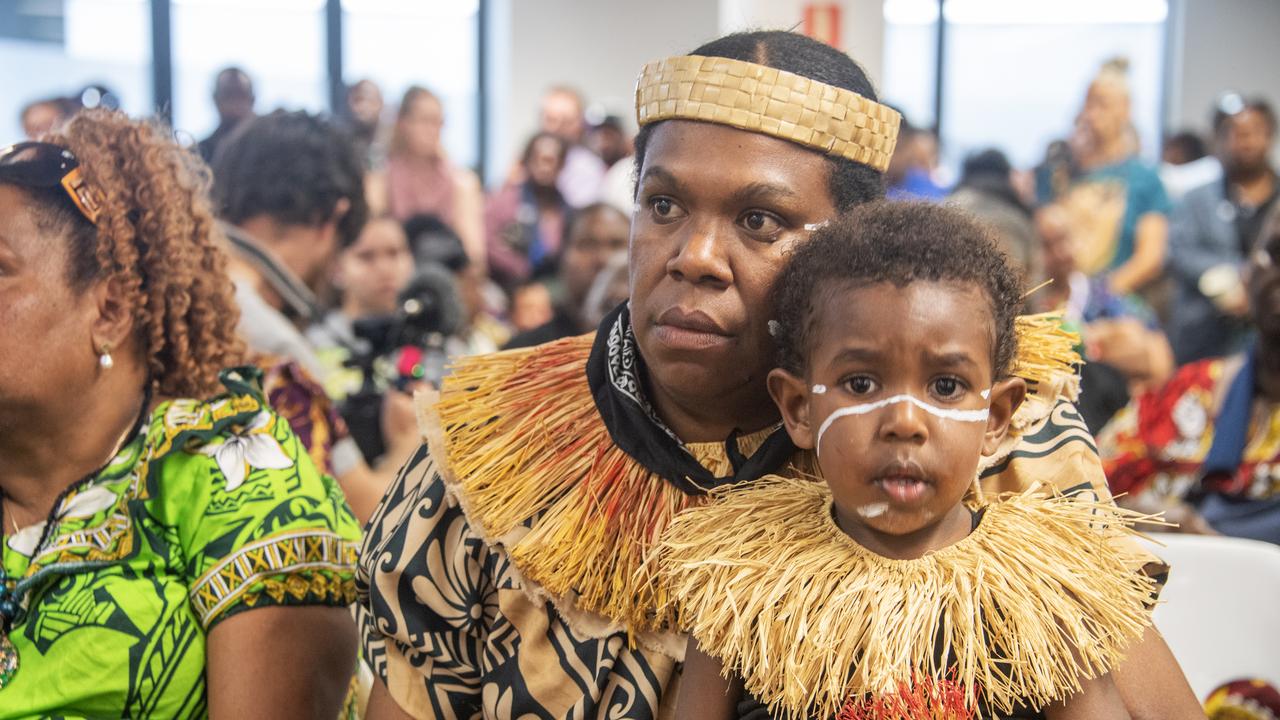 Donald Matthew sits with mum Gidina Waia listening to a court ruling