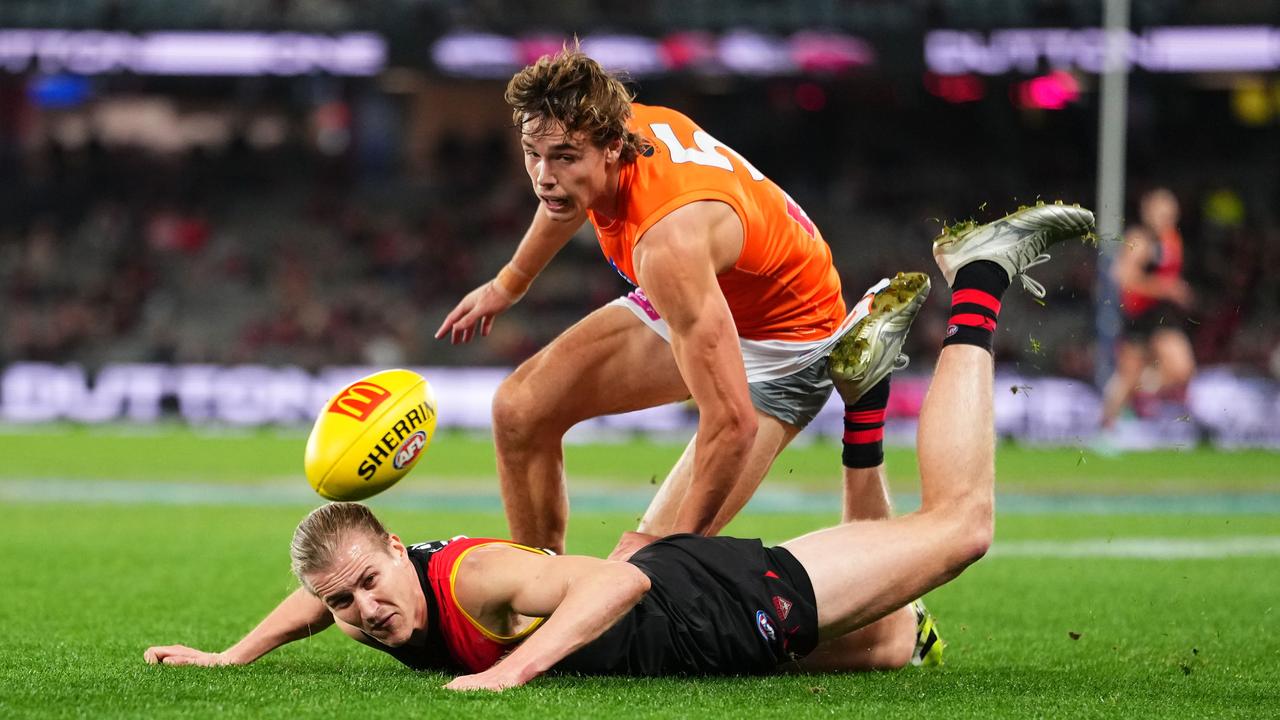 Lachlan Blakiston feels the pressure from the Giants' Aaron Cadman.