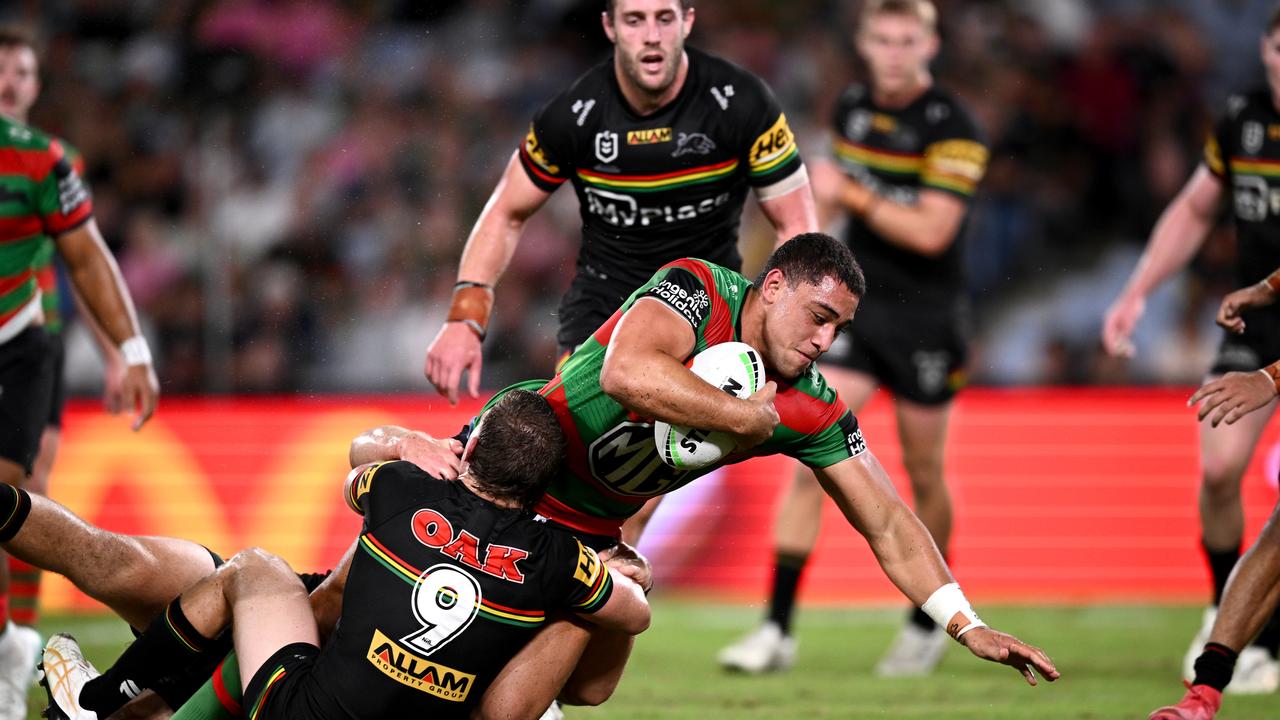 Penrith players effect a tackle.