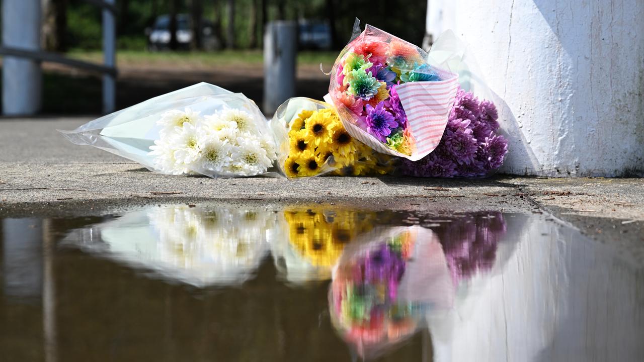 Flower tributes at the site of a water tragedy