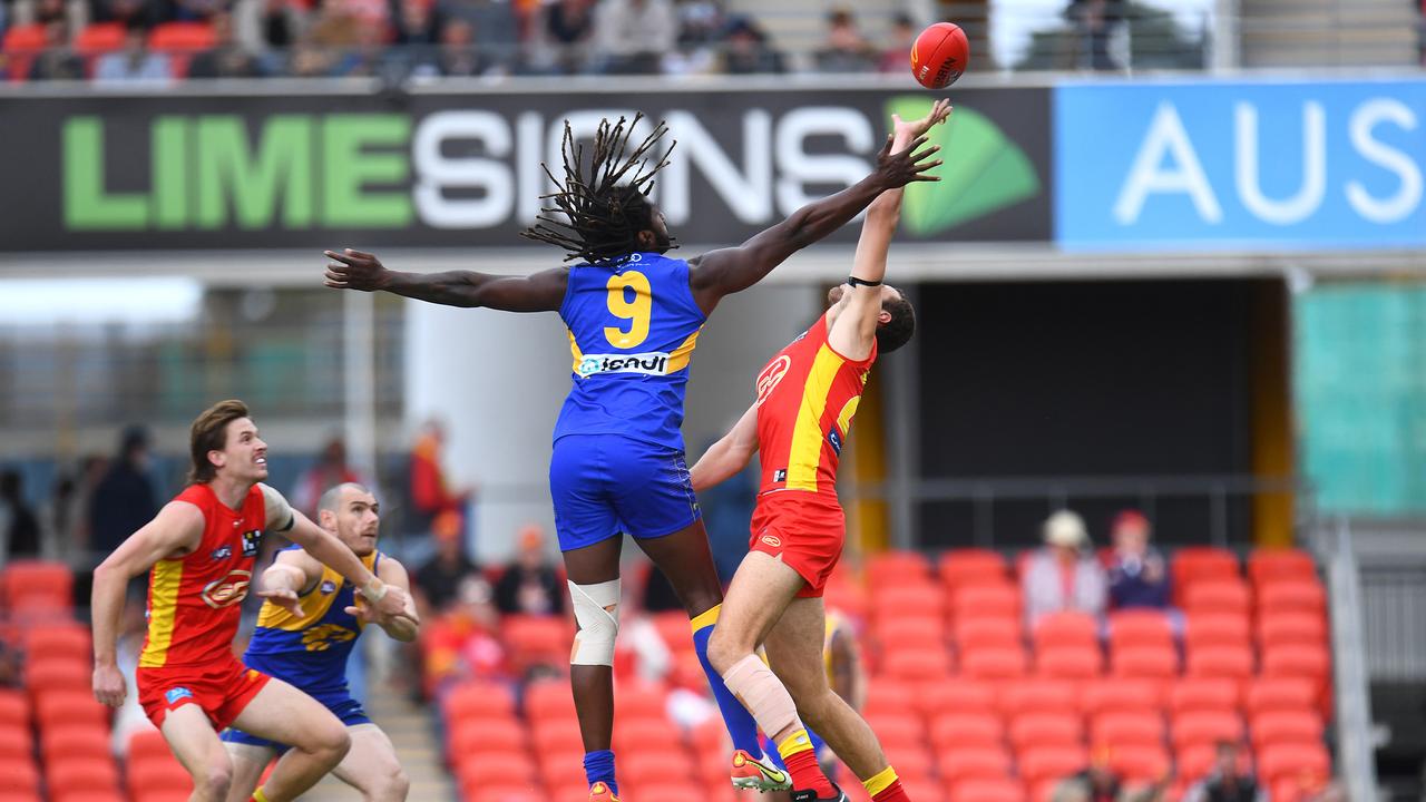 Nic Naitanui competes with Jarrod Witts.