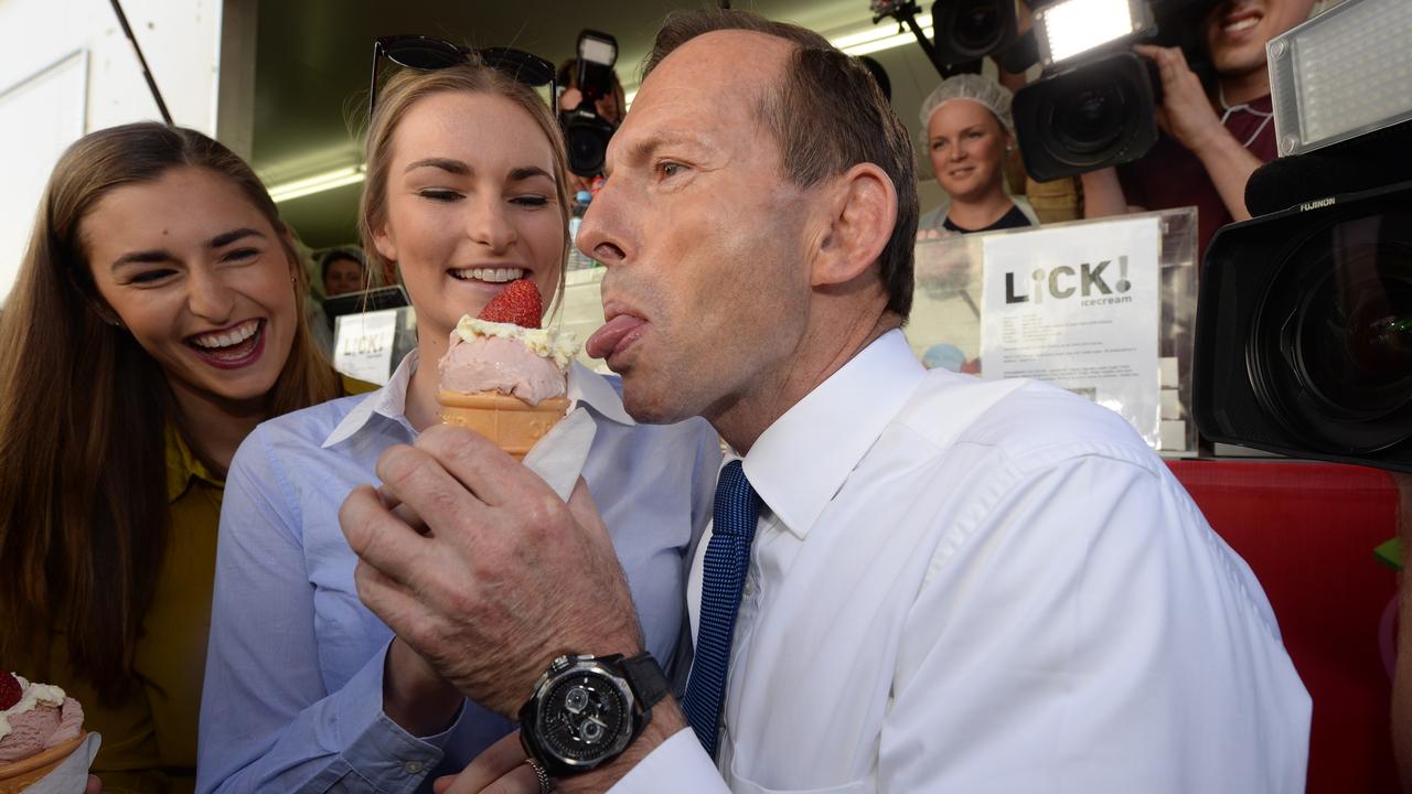 Former prime minister Tony Abbott and his daughters taste a sundae
