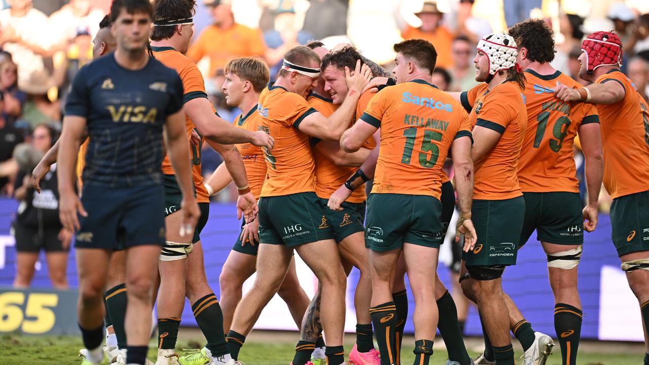 Wallabies celebrate their come-from-behind win over Argentina.