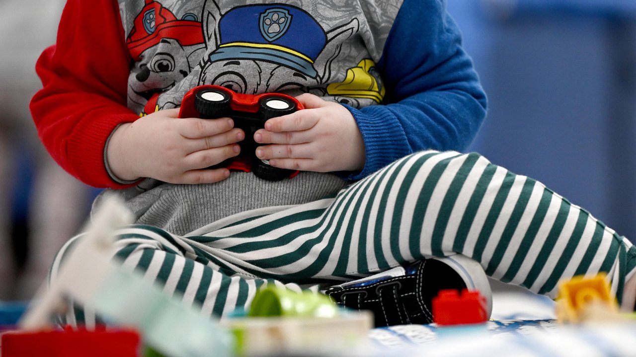 Young children play with interactive toys