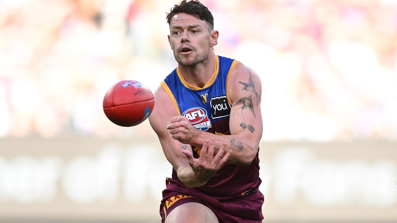 Lachie Neale fires out a handball