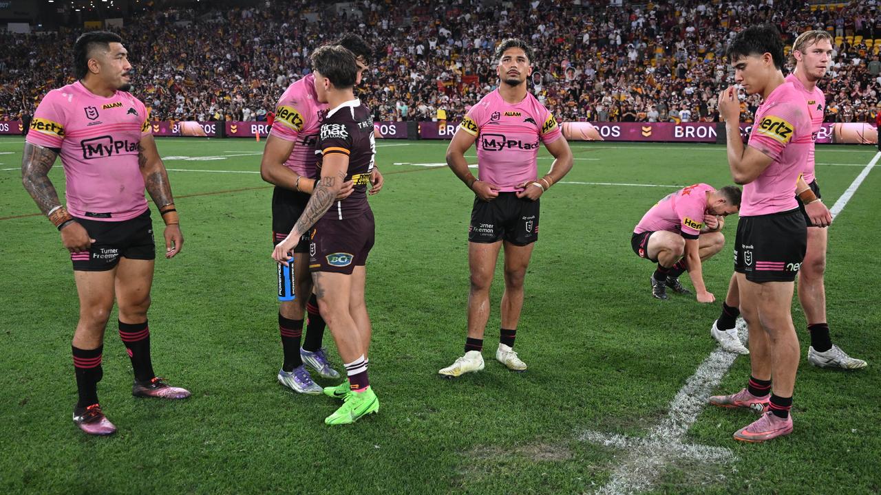 Brisbane's Reece Walsh talks with some of the Panthers