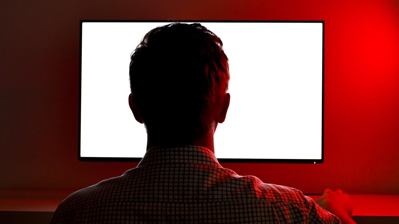 Man looks at screen