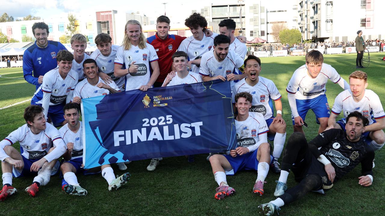 Celebrating Newcastle Jets players.