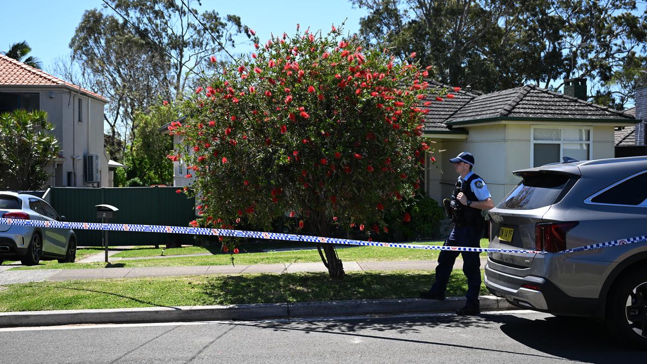 NSW Police outside a house