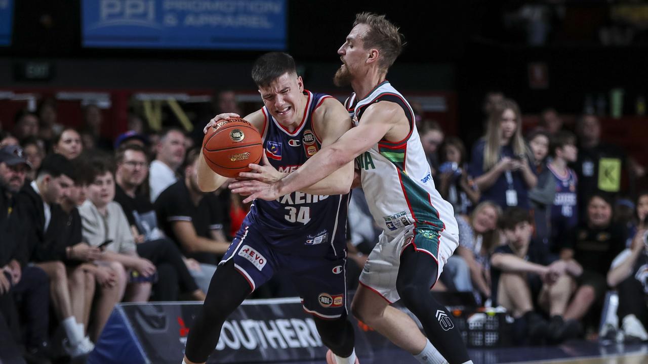Dejan Vasiljevic and Tasmania's Anthony Drmic.
