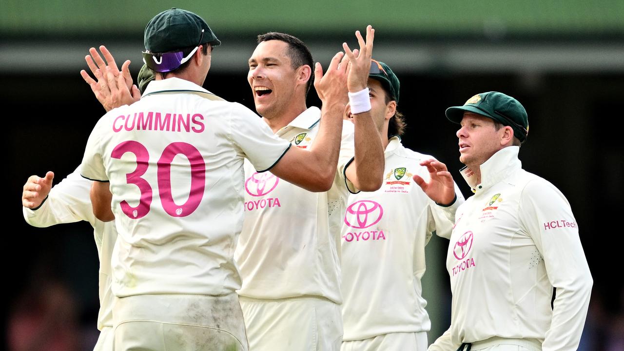 Pat Cummins congratulates Scott Boland.