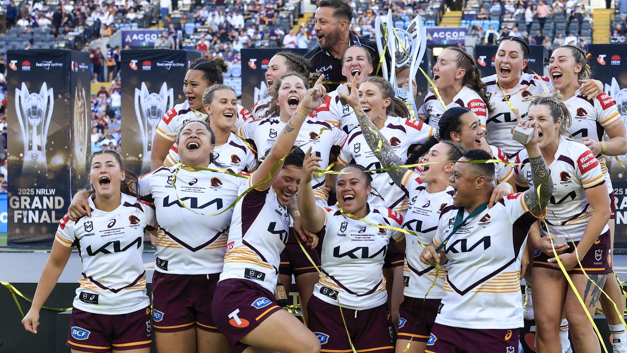 Broncos players celebrate with the NRL Women's Premiership Trophy