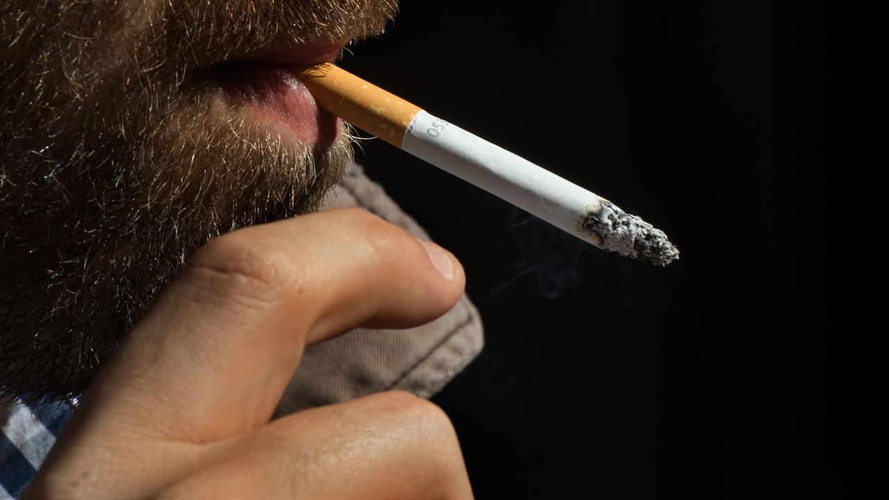 A smoker having a cigarette