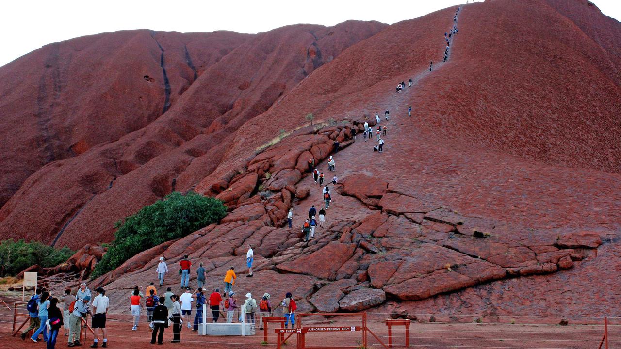 People climbing Uluru