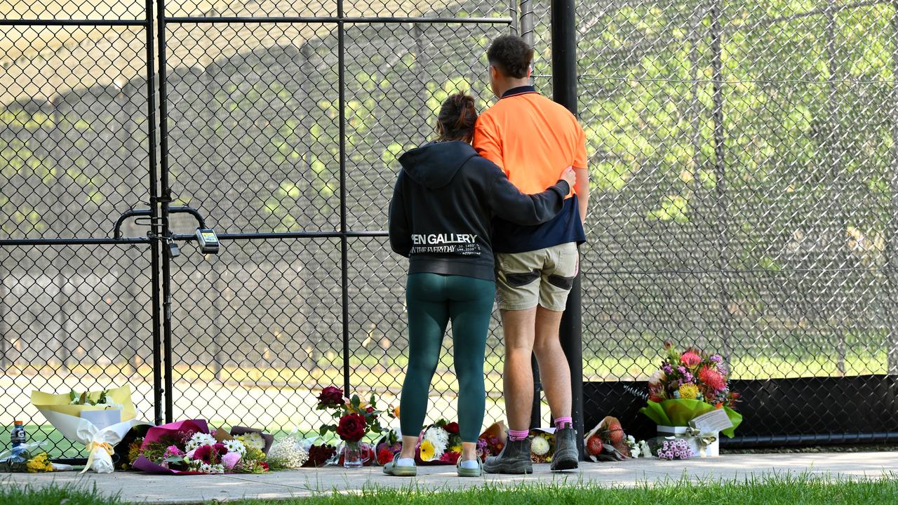 Mourners at the cricket training facility at Wally Tew Reserve