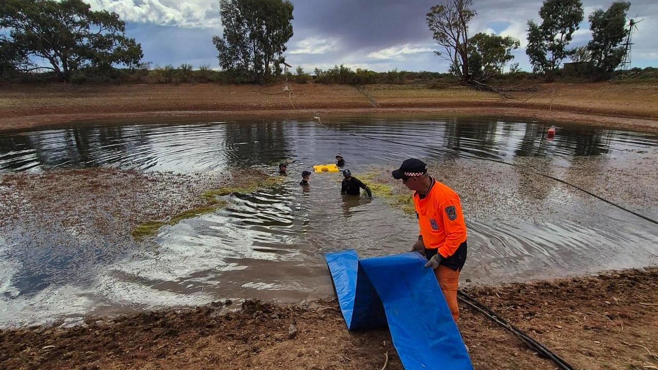 Police drain and search the dam