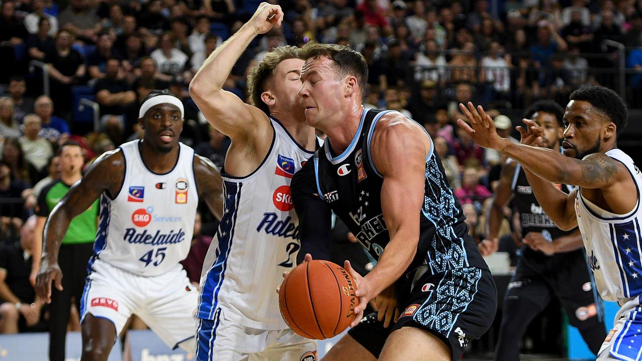 Sam Mennenga has a close encounter with Adelaide's Isaac White.