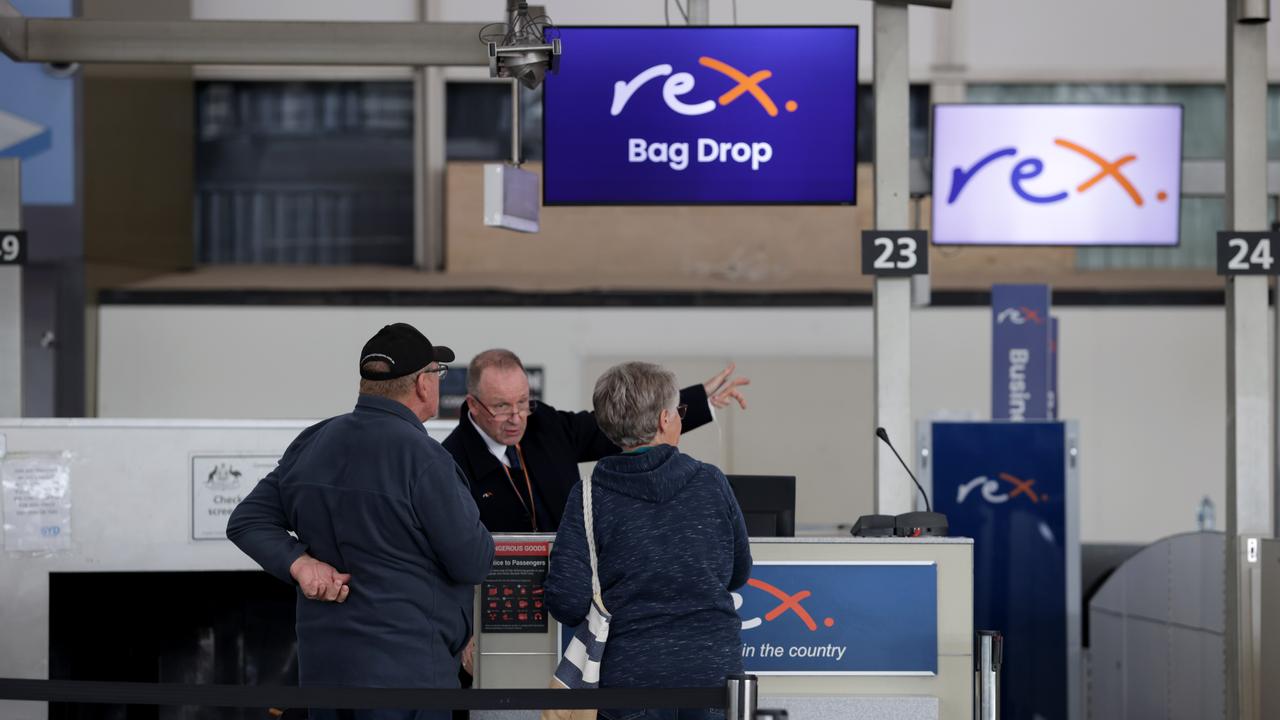 Rex staff and passengers at Sydney Domestic Airport in Sydney