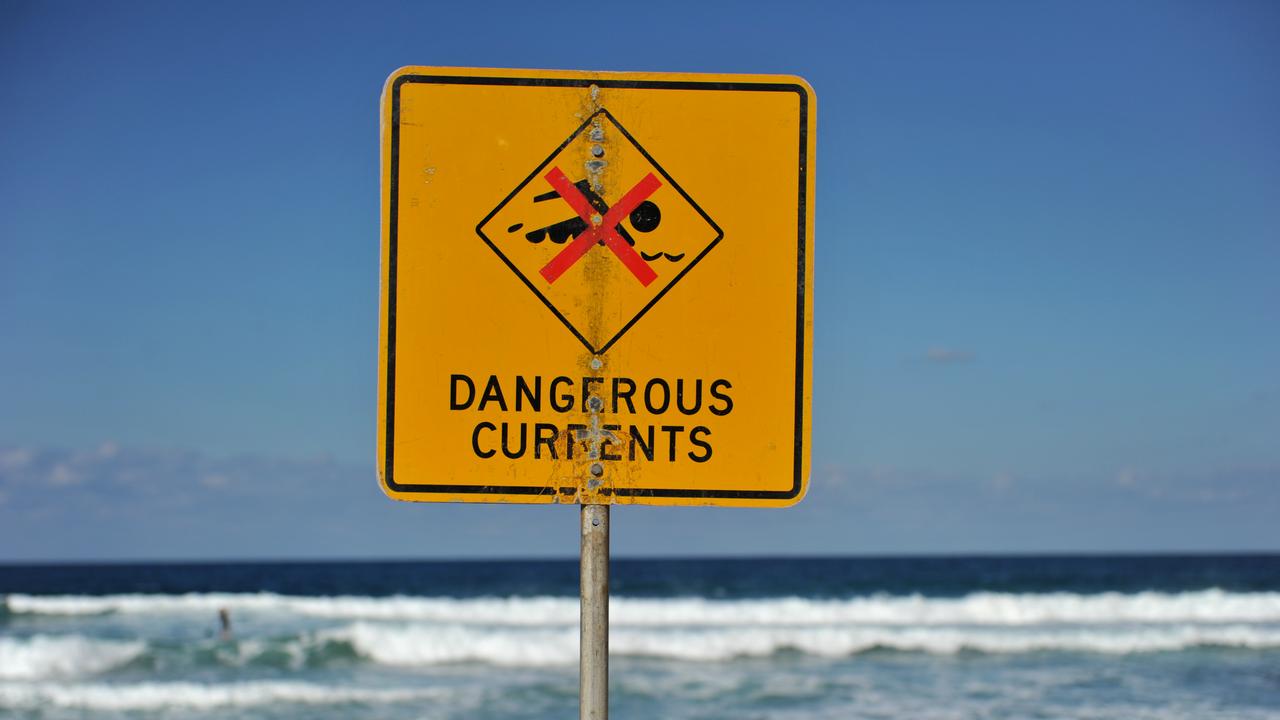 A sign warning of dangerous currents at Bondi Beach in Sydney