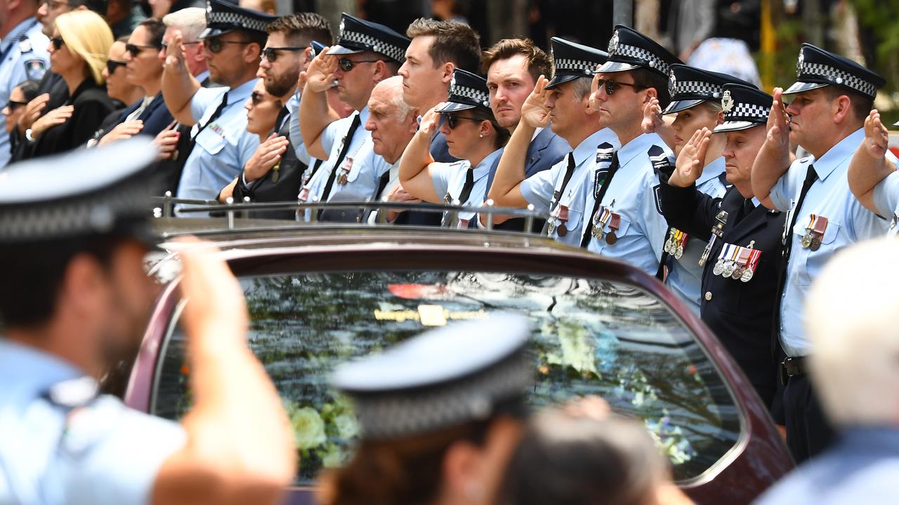 Police officers salute during a memorial service (file image)