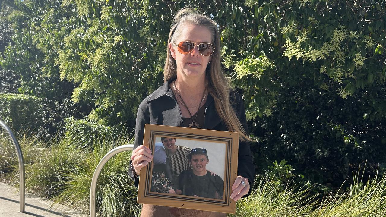 Myfanwy Webb holds a photo of her son Jeremy Webb