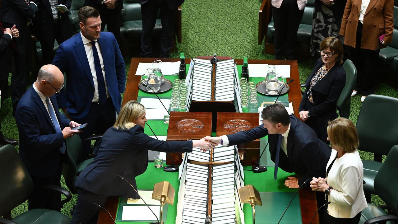 Jess Wilson shakes hands with Deputy Premier Ben Carroll