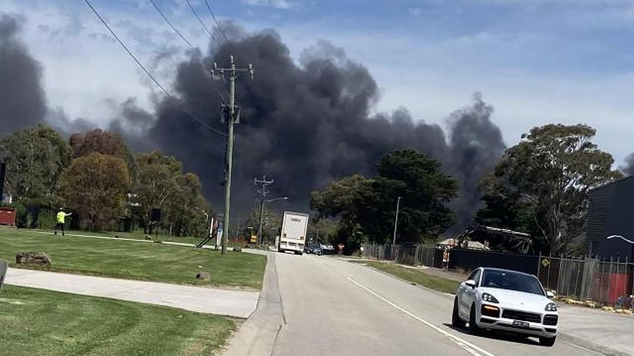 smoke from a large factory fire at a paint factory