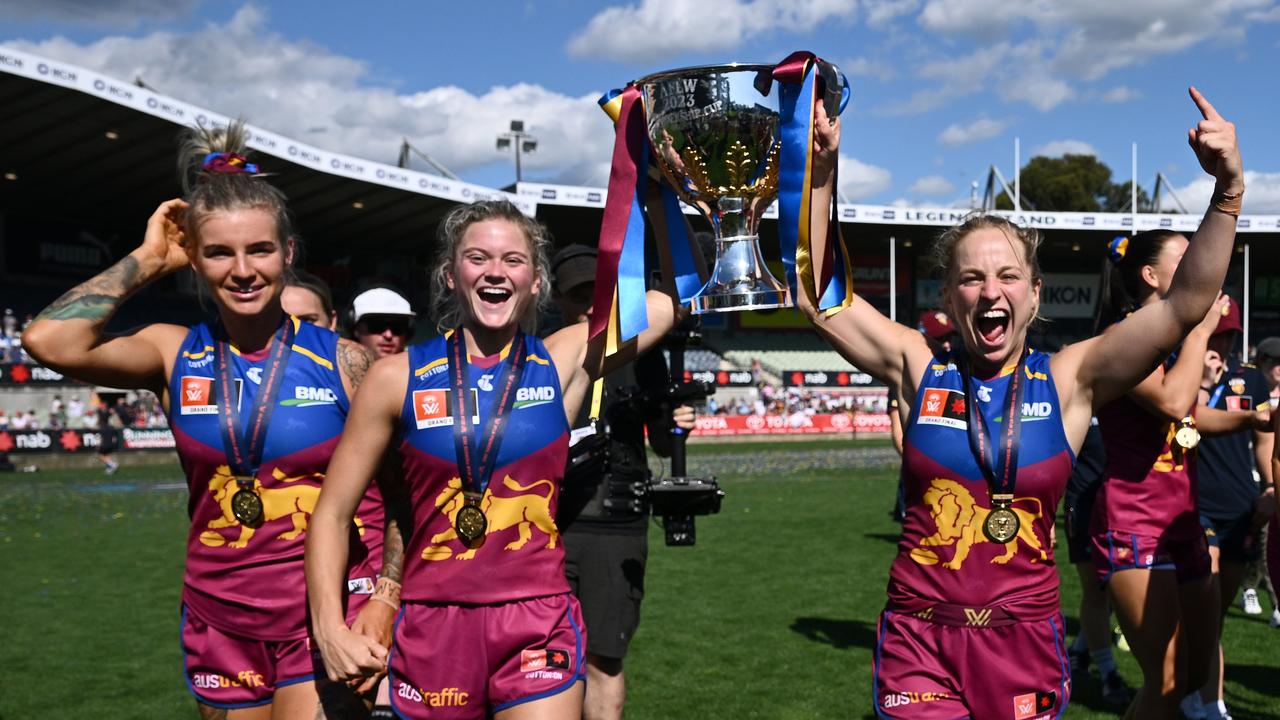 Brisbane Lions players celebrate