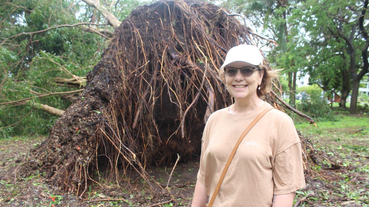 Sharon Thurston in front of a felled tree. 