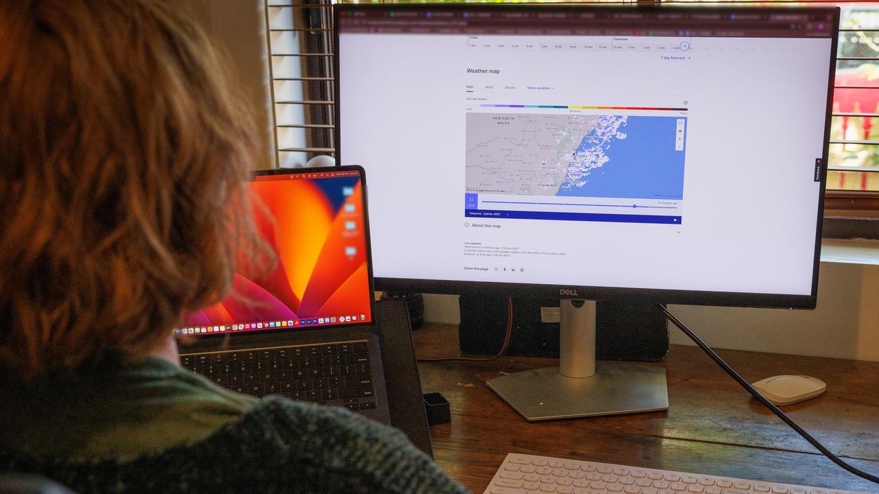 A person uses the BOM weather website