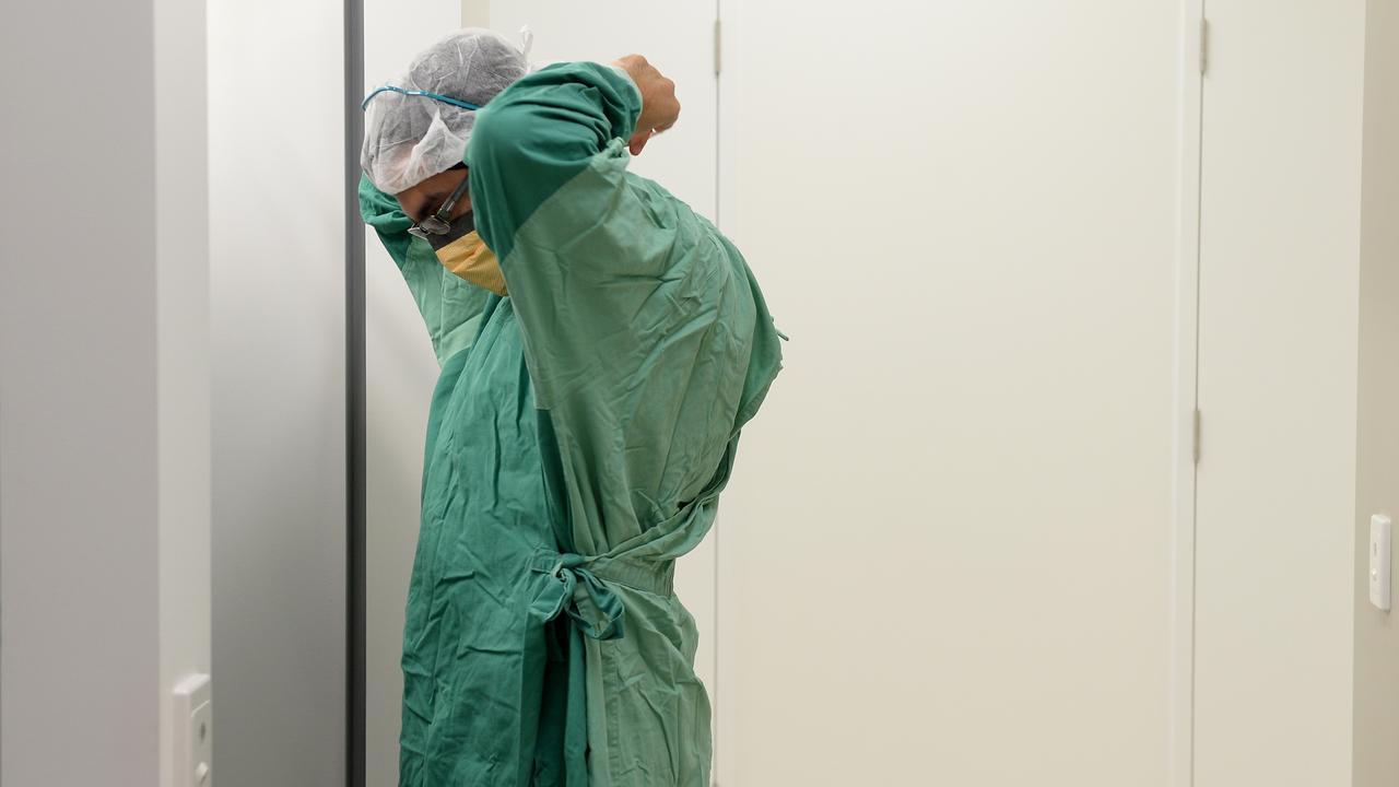 A surgeon prepares for theatre