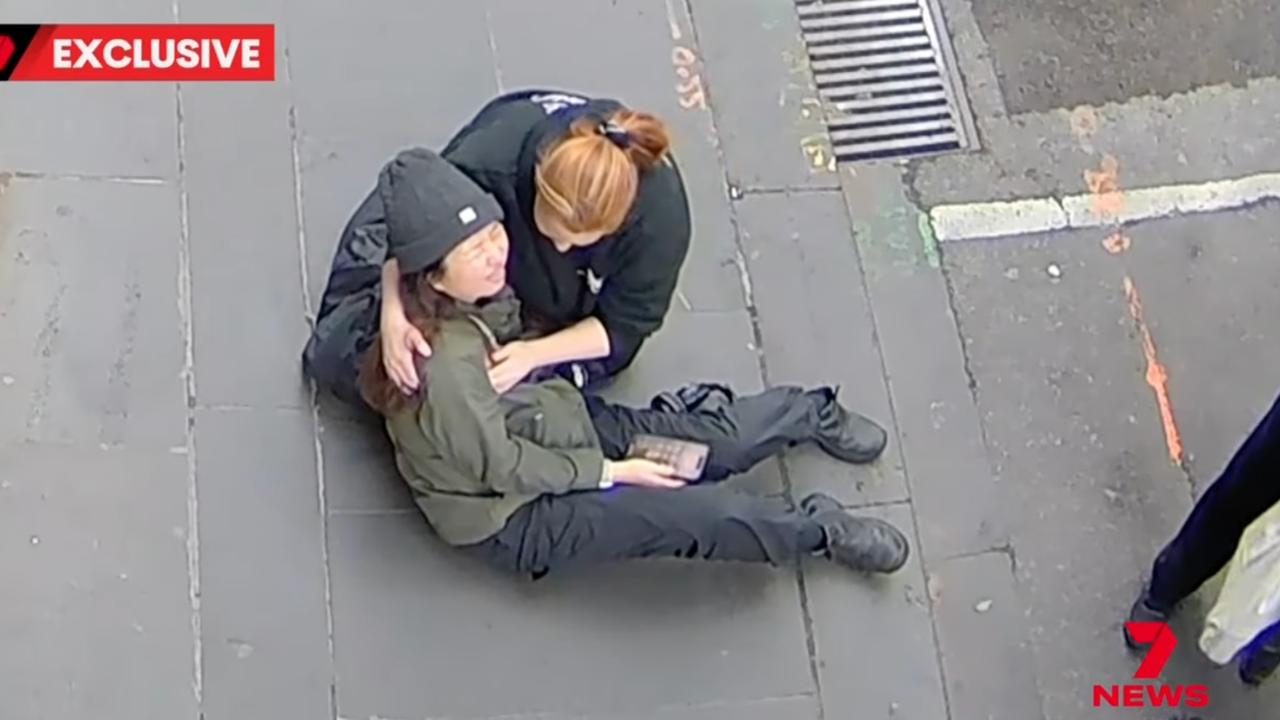 Wan Lai being comforted (file)