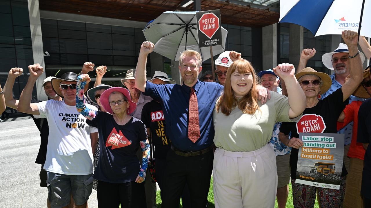 Ben Pennings and his daughter Isabella celebrate with supporters