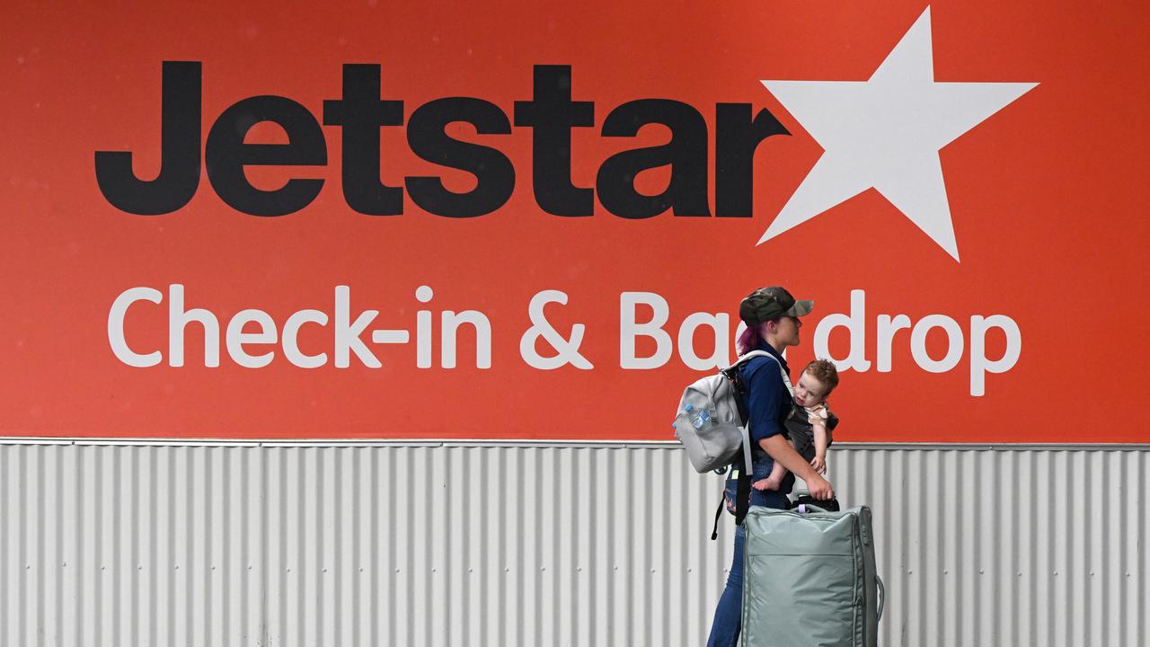 Passengers as flights are disrupted at Brisbane Airport in Brisbane