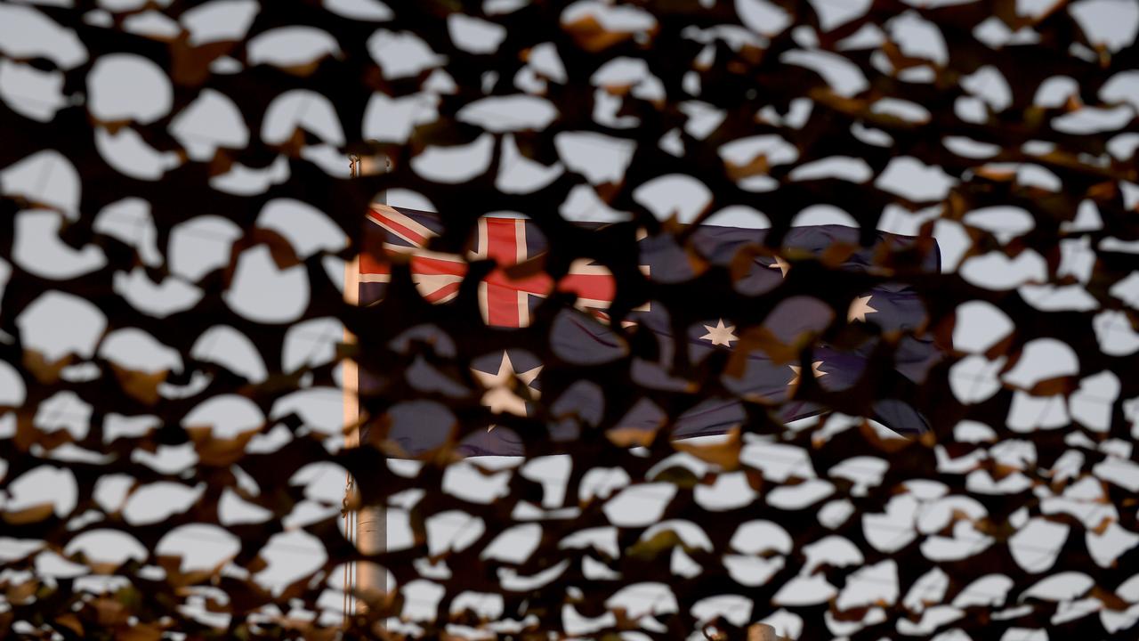 The Australian flag is seen through netting.