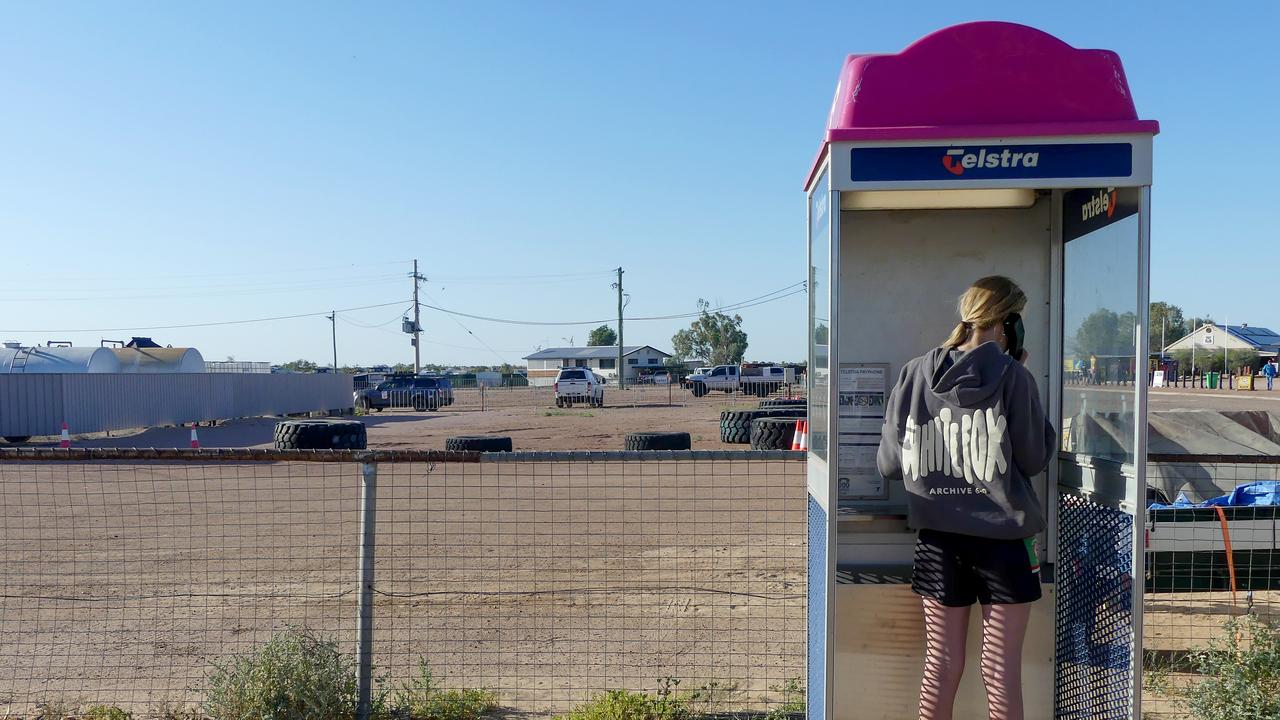 Woman uses phone box