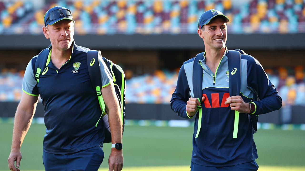Coach Andrew McDonald (left) and Pat Cummins