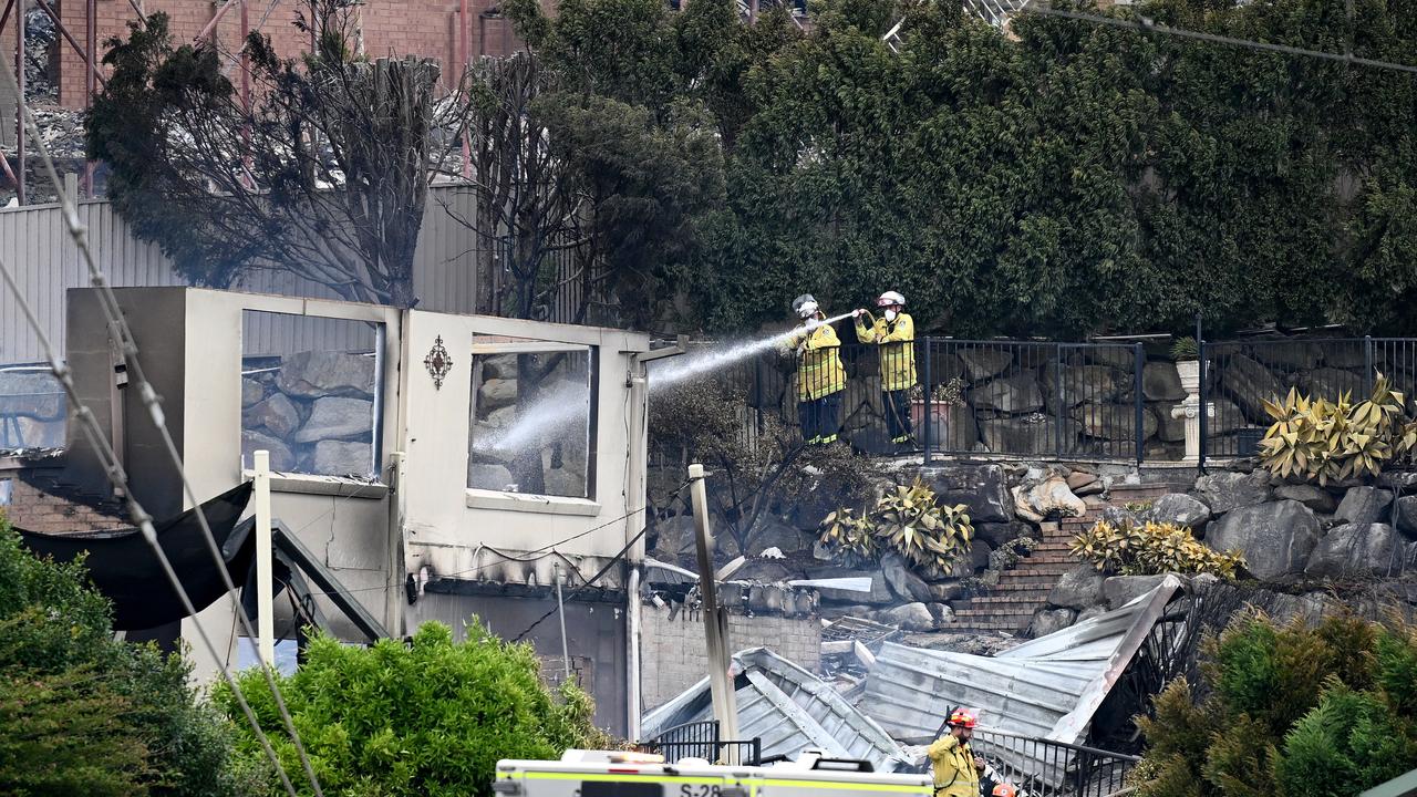Firefighters hose down a property at Koolewong