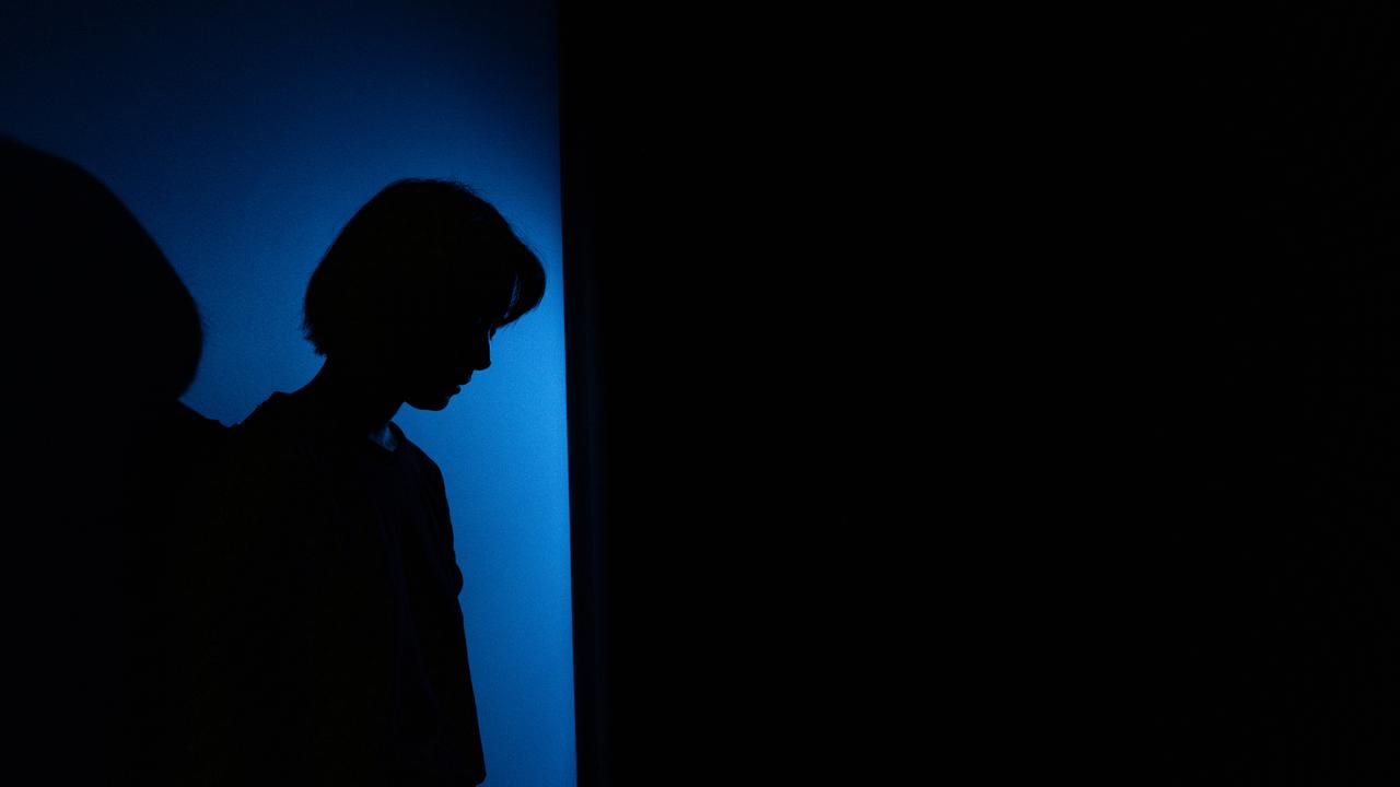 A person stands beside a wall (file image)
