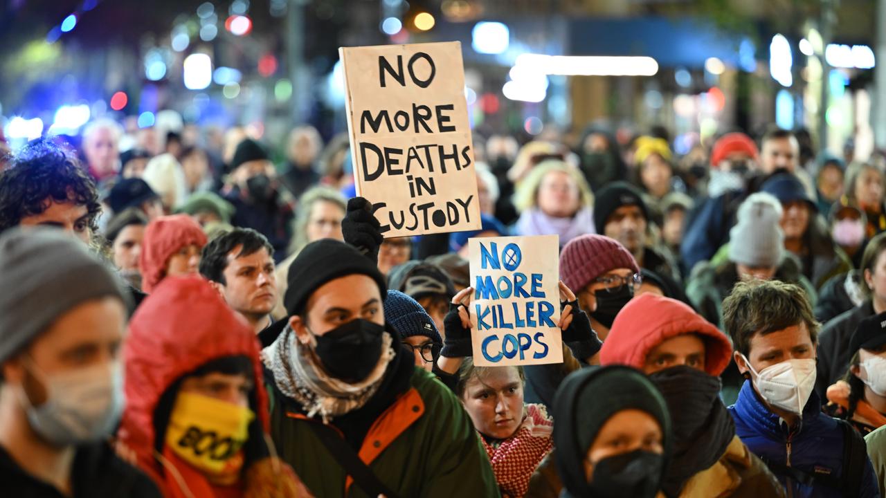 Protesters hold placards (file image)