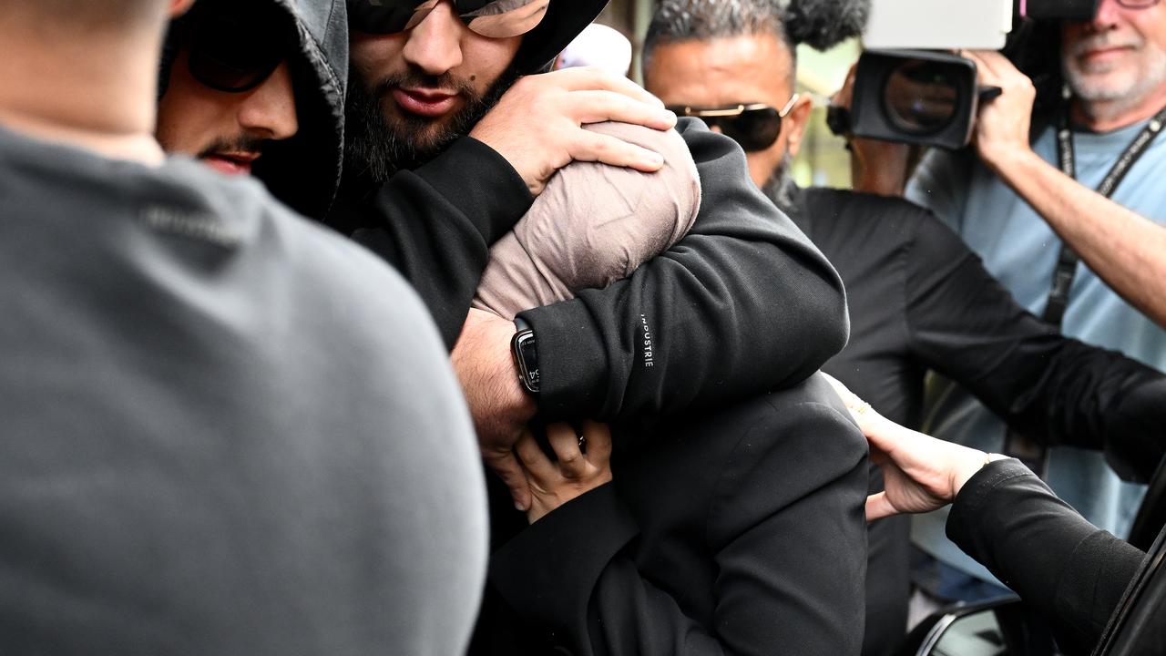 Sarah Abu Lebdeh (centre, file)